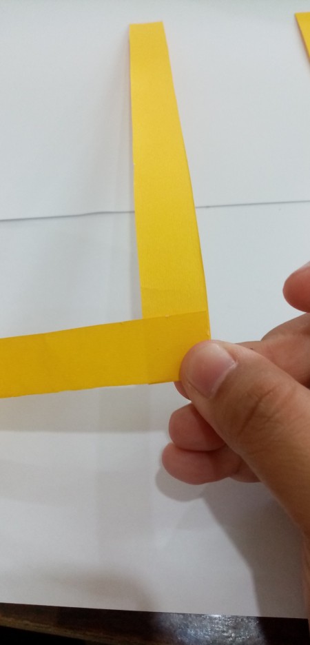 Joining the strips of paper.