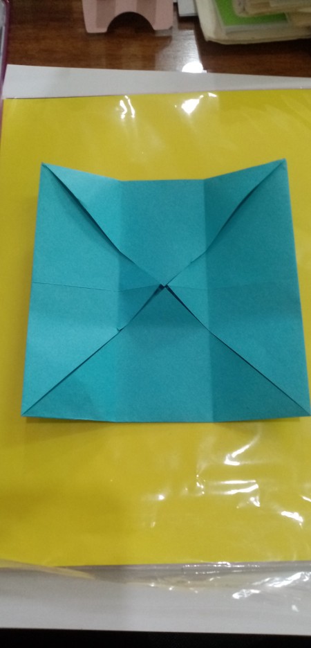 Folding paper to make the box.