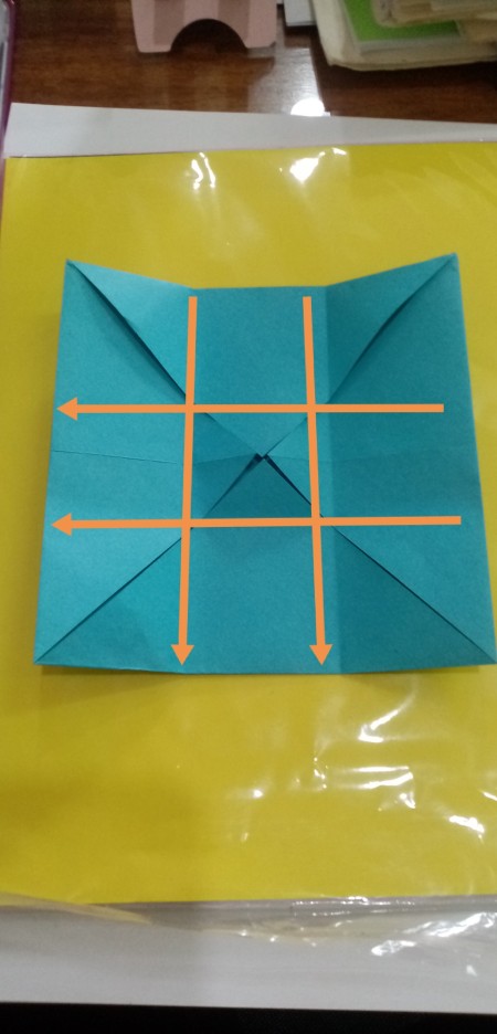 Folding paper to make the box.