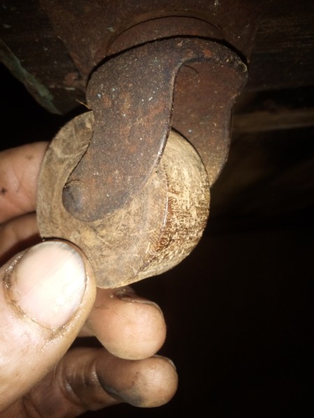 The wooden wheels on a truck.