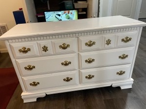 A white dresser with 6 drawers.