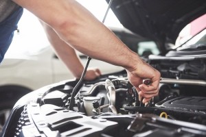 A mechanic working on a car.