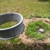 A septic tank in a yard.