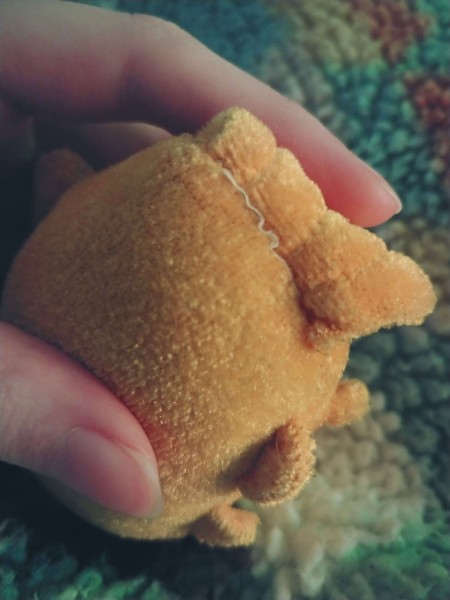 The underside of a stuffed fish.