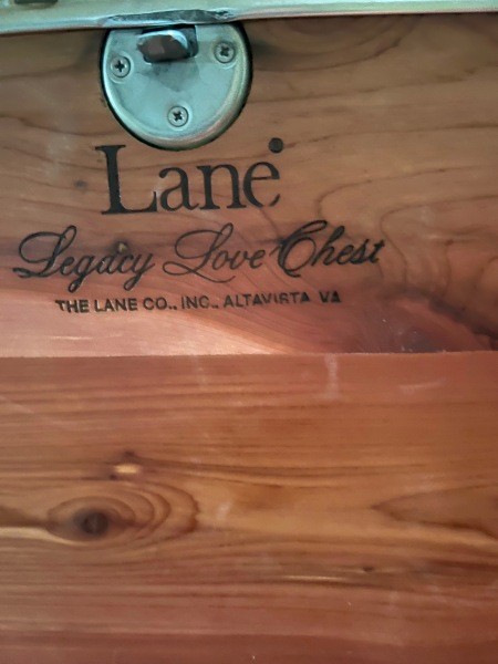 The Lane logo inside a cedar chest.