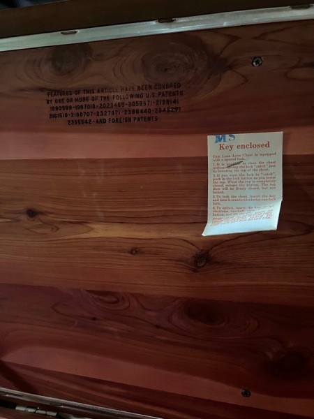 A tag inside a cedar chest.