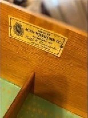 A tag inside a dresser drawer.