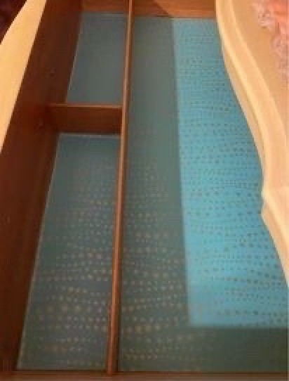 The inside of a dresser drawer.