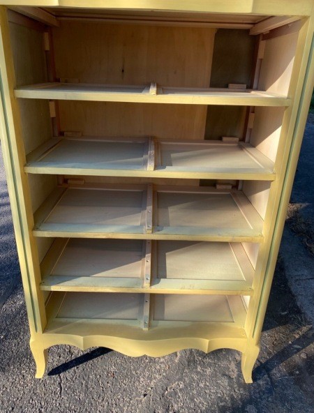 A tall dresser with the drawers removed.