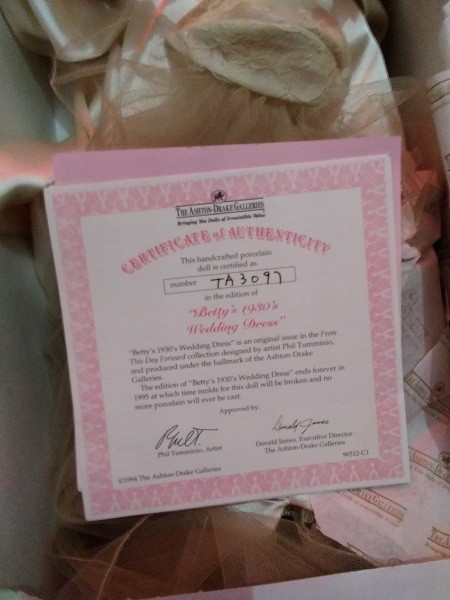 The certificate of authenticity for a porcelain doll.