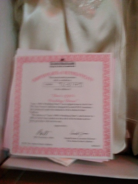The certificate of authenticity for a porcelain doll.