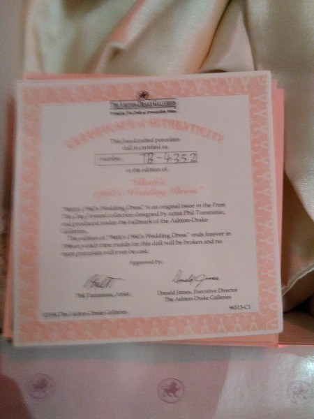 The certificate of authenticity for a porcelain doll.