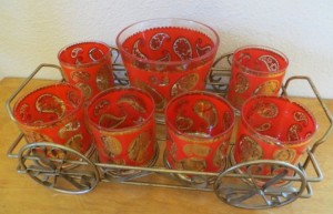 A collection of decorative glassware in red and gold.