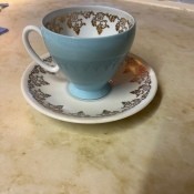 A china cup and saucer.