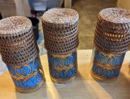 Decorative glasses with woven bamboo coasters.