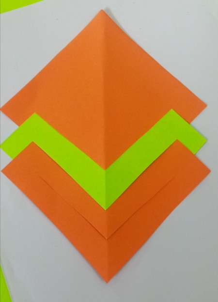 Assembling the folded paper squares.