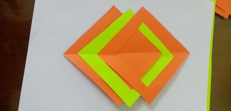 Assembling the folded paper squares.