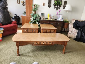 A coffee table and set of matching end tables.