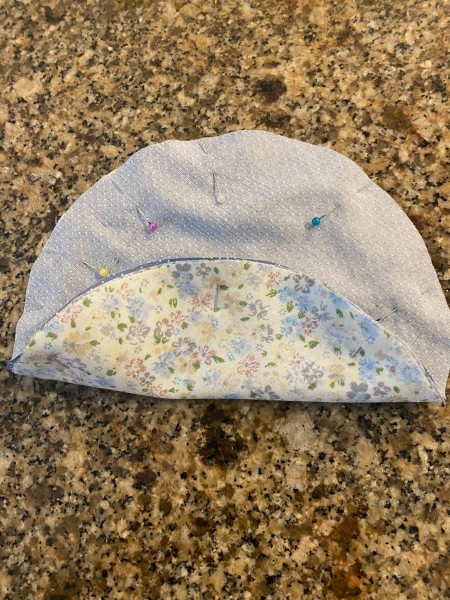 The cut and pinned fabric circle.