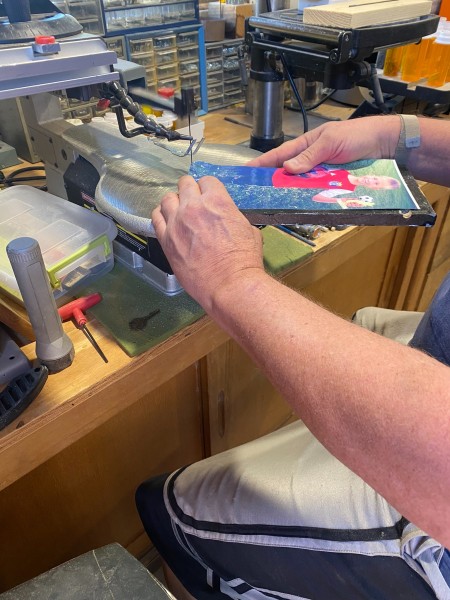 Cutting out the body shape with a scroll saw.