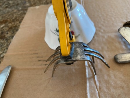 Attaching the fork pieces together to make legs.