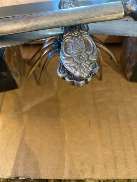 Gluing the silverware together.