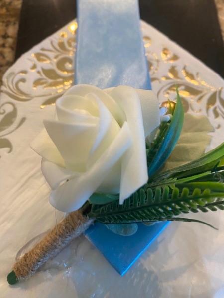 Attaching the items to the decorative paper.