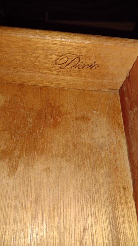 The Dixie furniture logo inside a drawer.