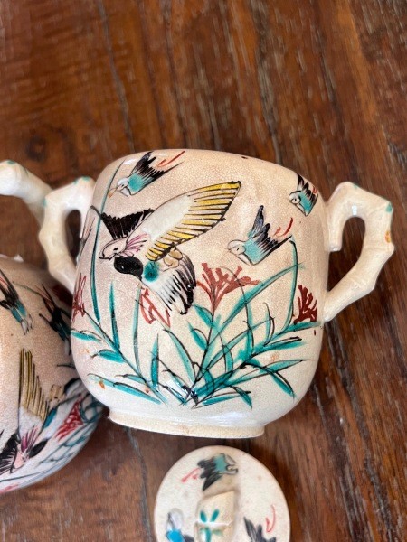 A painted ceramic tea pot set.