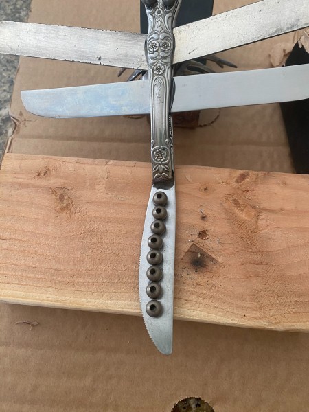 Adding decorations to the dragonfly's tail.