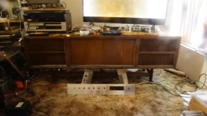 A long wooden stereo console.