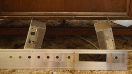 The underside of a stereo console.