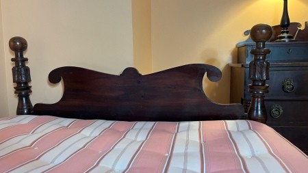 The wooden headboard.