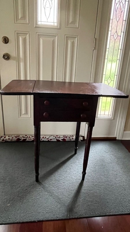 A small wooden nightstand.