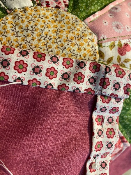 Attaching the quilt pieces together.