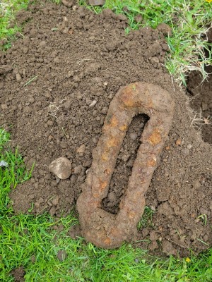 A rusty iron piece found in a farm.