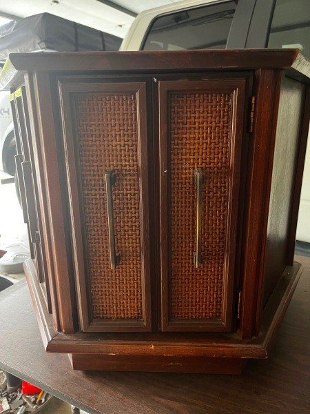 A Mersman end table with cabinets.