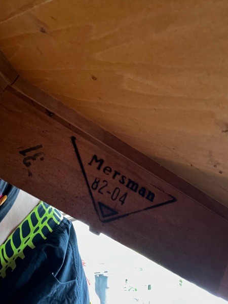 The Mersman logo inside a cabinet.