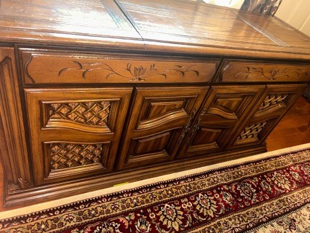 The front of a wooden stereo console.