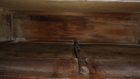 Inside a wooden drawer.