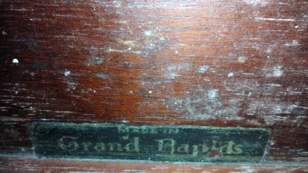 A manufacturer's tag on a piece of furniture.