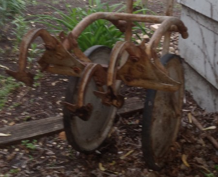 A metal piece of farm equipment.