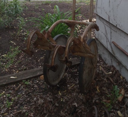 A metal piece of farm equipment.