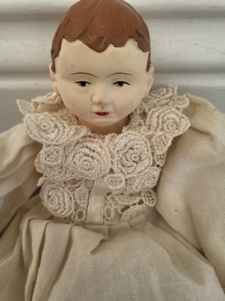 Close up of a doll's head.