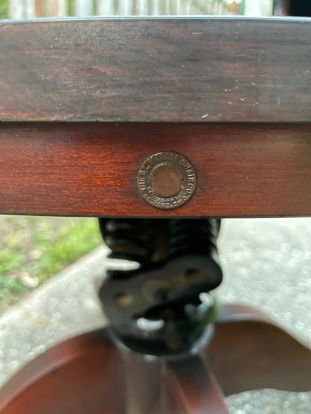The manufacture's marking on a wooden chair.
