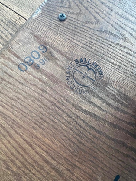 Conant Ball logo on the underside of the table.