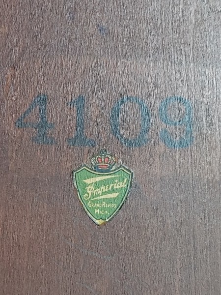 The manufacturer's information on the underside of a table.