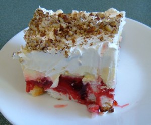 A piece of Cherry Trifle on a plate.