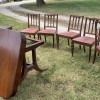 A dining table with 6 chairs.